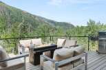 Experience breathtaking mountain views from this stunning deck, perfect for outdoor entertaining.