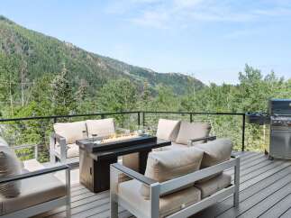 Experience breathtaking mountain views from this stunning deck, perfect for outdoor entertaining.