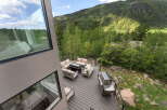 Experience breathtaking mountain views from this stunning deck, perfect for entertaining or relaxing.