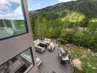 Experience breathtaking mountain views from this stunning deck, perfect for entertaining or relaxing.