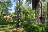 Experience serene living in this stunning property nestled amidst lush greenery and mature trees.