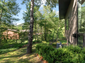 Experience serene living in this stunning property nestled amidst lush greenery and mature trees.