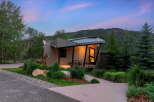 Experience modern mountain living in this stunning architectural home, nestled amidst lush greenery and majestic trees.