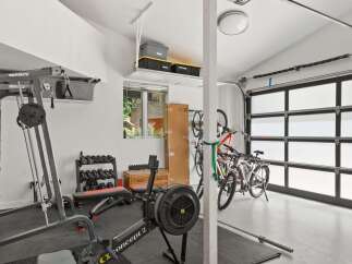 Transform your garage into a personal fitness sanctuary with this well-equipped home gym.