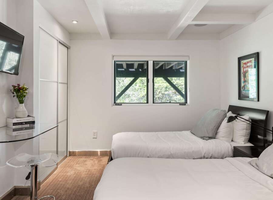 This bedroom features two comfortable twin beds, perfect for accommodating guests or family.