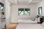 This bedroom features two comfortable twin beds, perfect for accommodating guests or family.