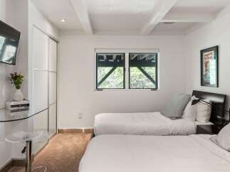 This bedroom features two comfortable twin beds, perfect for accommodating guests or family.