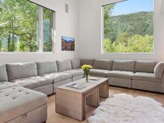 Experience modern living with this spacious sectional sofa, perfect for gathering with loved ones.