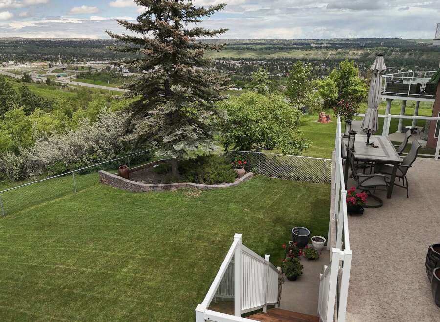 Enjoy breathtaking panoramic views from this stunning property, featuring a spacious backyard perfect for entertaining and relaxation.
