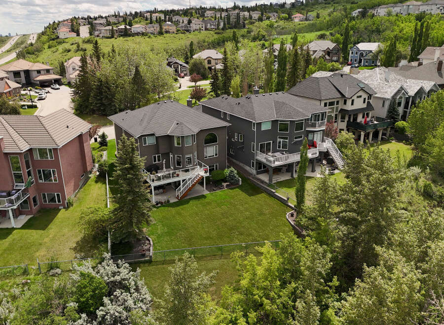 Discover luxury living in this stunning multi-level home, boasting expansive decks perfect for entertaining and enjoying the scenic hillside views.