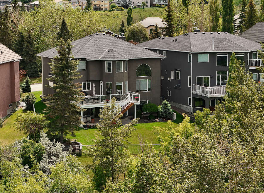 Experience luxury living in this stunning multi-level home, featuring expansive decks perfect for entertaining and enjoying the lush surroundings.