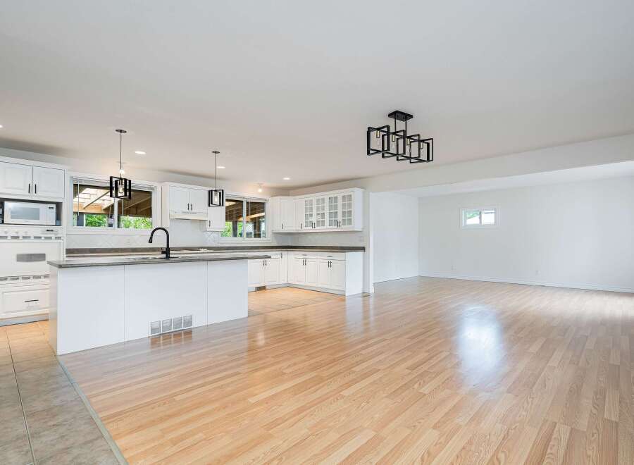 Discover this beautifully renovated open-concept kitchen and living space, perfect for modern living.