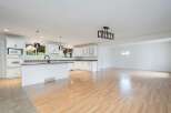 Discover this beautifully renovated open-concept kitchen and living space, perfect for modern living.