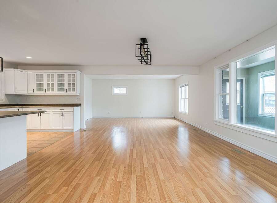 Discover this spacious open-concept living area, perfect for modern living and entertaining.
