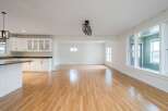 Discover this spacious open-concept living area, perfect for modern living and entertaining.