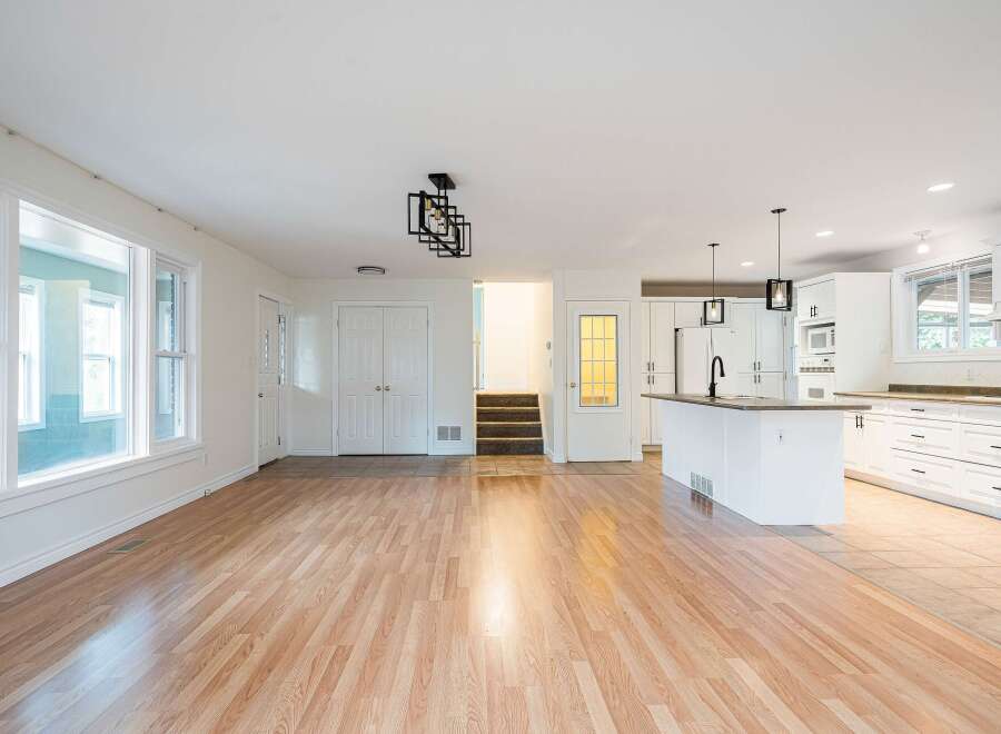Discover this spacious open-concept living area, perfect for modern living and entertaining.
