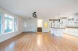 Discover this spacious open-concept living area, perfect for modern living and entertaining.