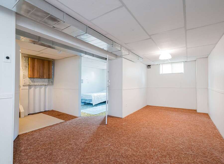 Discover the potential of this unfinished basement, offering a blank canvas for your dream living space.