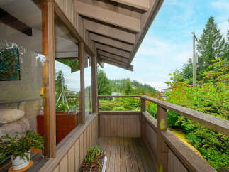 Enjoy breathtaking views from this charming balcony, perfect for morning coffee or evening relaxation.