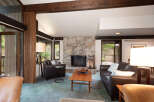 Experience rustic charm in this inviting living room, featuring a magnificent stone fireplace as the centerpiece.