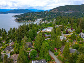 Discover luxurious living in this stunning waterfront community, nestled amidst lush evergreen forests and offering breathtaking ocean views.