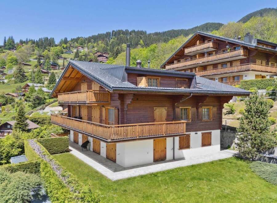 Experience luxurious alpine living in this stunning wooden chalet, nestled amidst a picturesque mountain village.