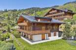 Experience luxurious alpine living in this stunning wooden chalet, nestled amidst a picturesque mountain village.