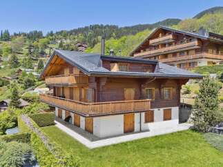 Experience luxurious alpine living in this stunning wooden chalet, nestled amidst a picturesque mountain village.