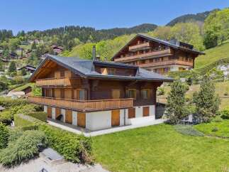 Experience luxurious alpine living in this stunning wooden chalet, nestled amidst rolling green hills and picturesque mountain scenery.