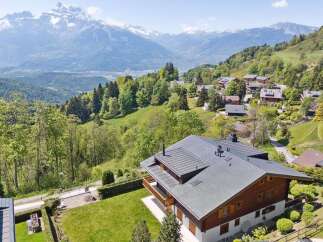 Experience breathtaking mountain views from this stunning chalet nestled in a serene alpine village.