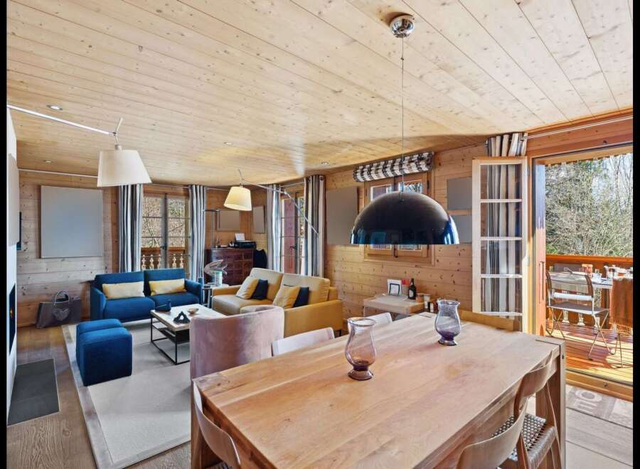 Experience rustic charm and modern comfort in this beautifully appointed living and dining area.