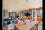 Experience rustic charm and modern comfort in this beautifully appointed living and dining area.