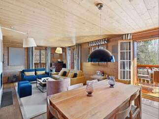 Experience rustic charm and modern comfort in this beautifully appointed living and dining area.