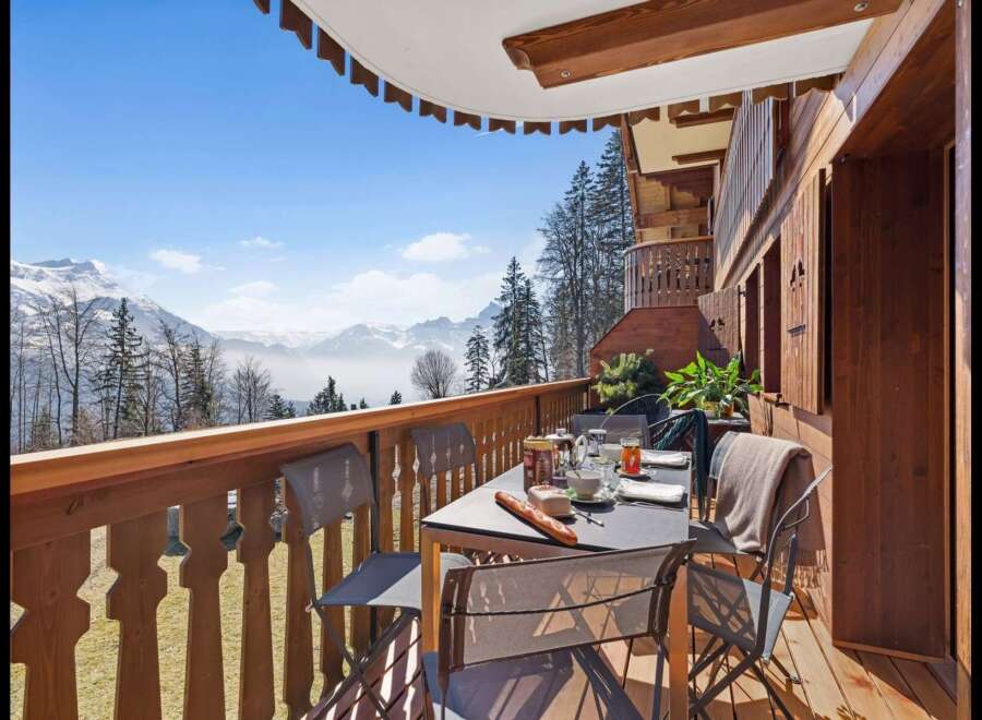 Enjoy breathtaking mountain views from this charming balcony, perfect for a morning coffee or evening relaxation.