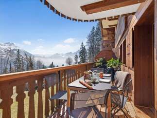 Enjoy breathtaking mountain views from this charming balcony, perfect for a morning coffee or evening relaxation.