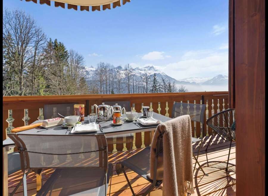Enjoy a delightful breakfast on this balcony with breathtaking mountain views.