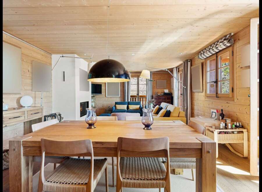 Experience rustic charm and modern comfort in this inviting dining and living space.