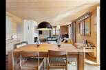Experience rustic charm and modern comfort in this inviting dining and living space.
