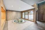 Indulge in relaxation in this luxurious spa area, featuring a circular jacuzzi perfect for unwinding.
