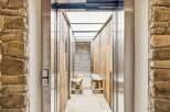 Experience rustic charm and modern convenience in this unique elevator entrance.