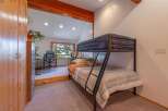 This charming bedroom features a space-saving bunk bed, perfect for accommodating guests or children.