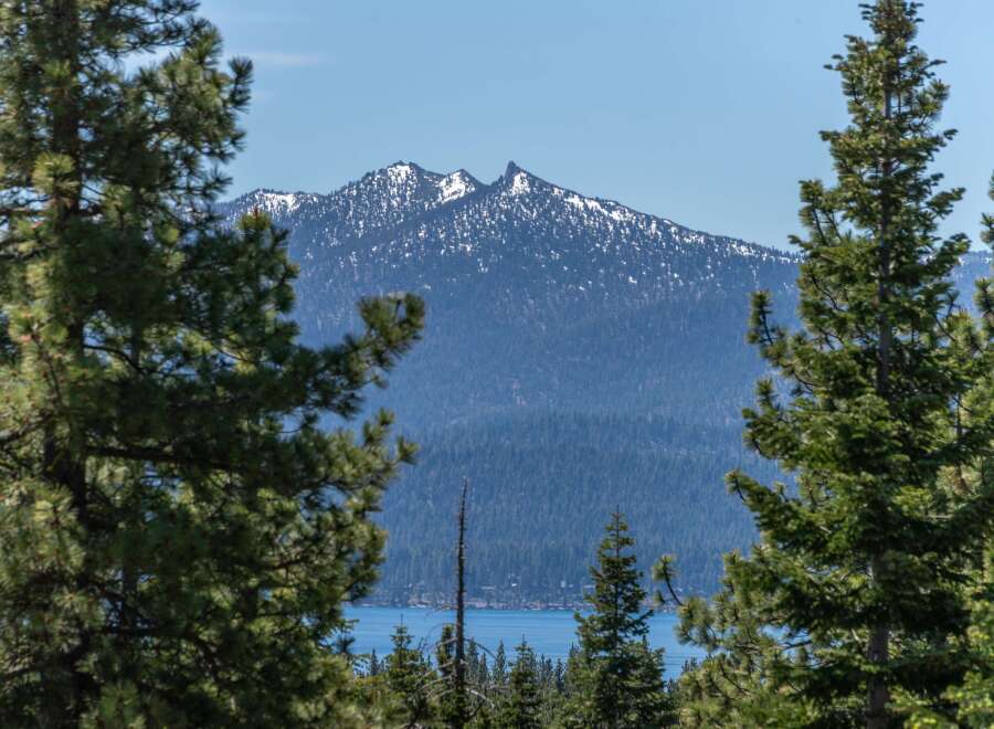 Experience breathtaking mountain views and serene lakefront living from this stunning property.