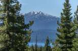 Experience breathtaking mountain views and serene lakefront living from this stunning property.