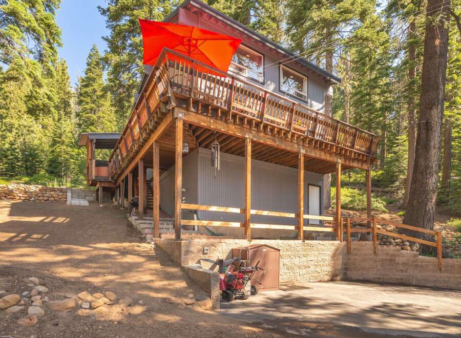 Nestled amidst tall pine trees, this multi-level home offers a unique mountain retreat.