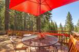 Enjoy breathtaking mountain views from this expansive wooden deck, perfect for outdoor dining and relaxation.