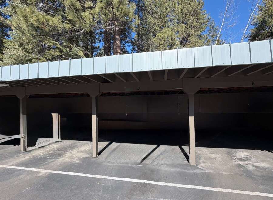 Discover convenient covered parking with this spacious carport, perfect for protecting your vehicles from the elements.
