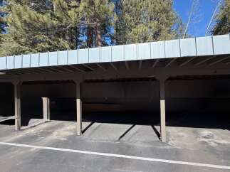 Discover convenient covered parking with this spacious carport, perfect for protecting your vehicles from the elements.