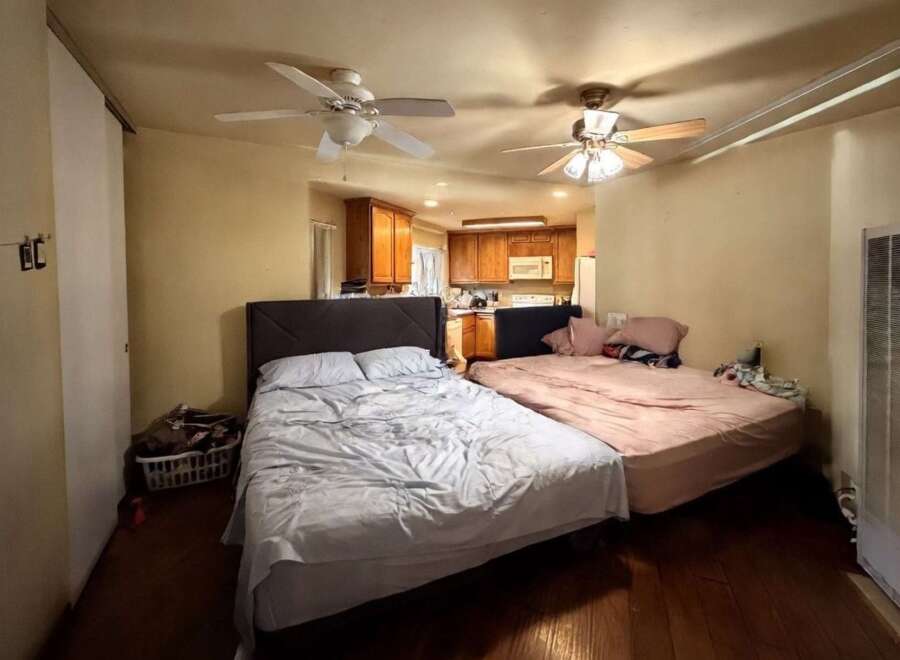 This cozy studio apartment features two beds, perfect for roommates or a small family.