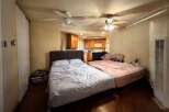 This cozy studio apartment features two beds, perfect for roommates or a small family.