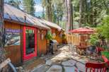 Enjoy outdoor living in this charming backyard featuring a spacious stone patio perfect for entertaining.